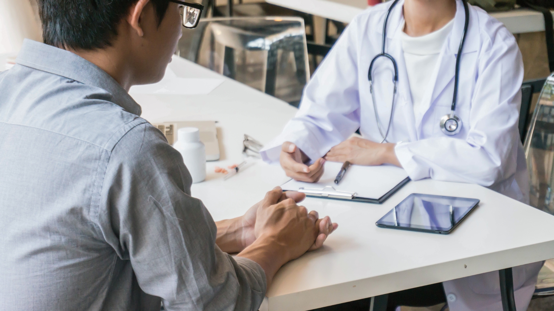 Doctor in consultation with male patient at nuuhealth
